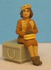 Omen - Sitting woman, wearing a 'pill-box' hat