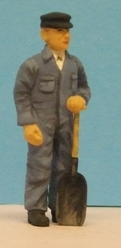 Omen - Steam loco fireman, standing with shovel, in a boiler-suit