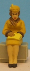 Omen - Seated woman looking into her handbag