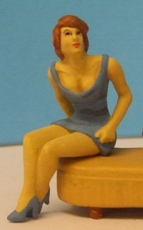 Omen - Seated girl in a mini-dress, looking up